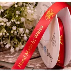 10mm Red double satin ribbon with metallic gold made in Wales print