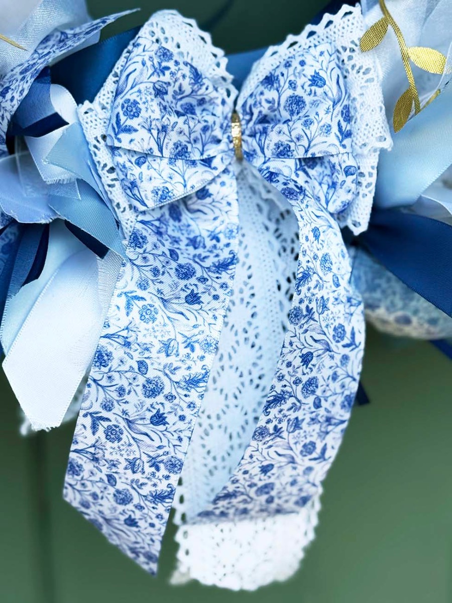 Close up of handmade bow on blue garden wreath kit